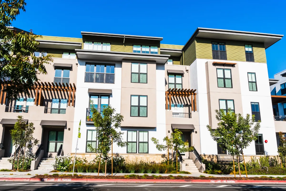 Condo remodeling project in Los Angeles for a multi-unit residential property with modern exterior, updated windows, balconies, landscaping, and shared building improvements