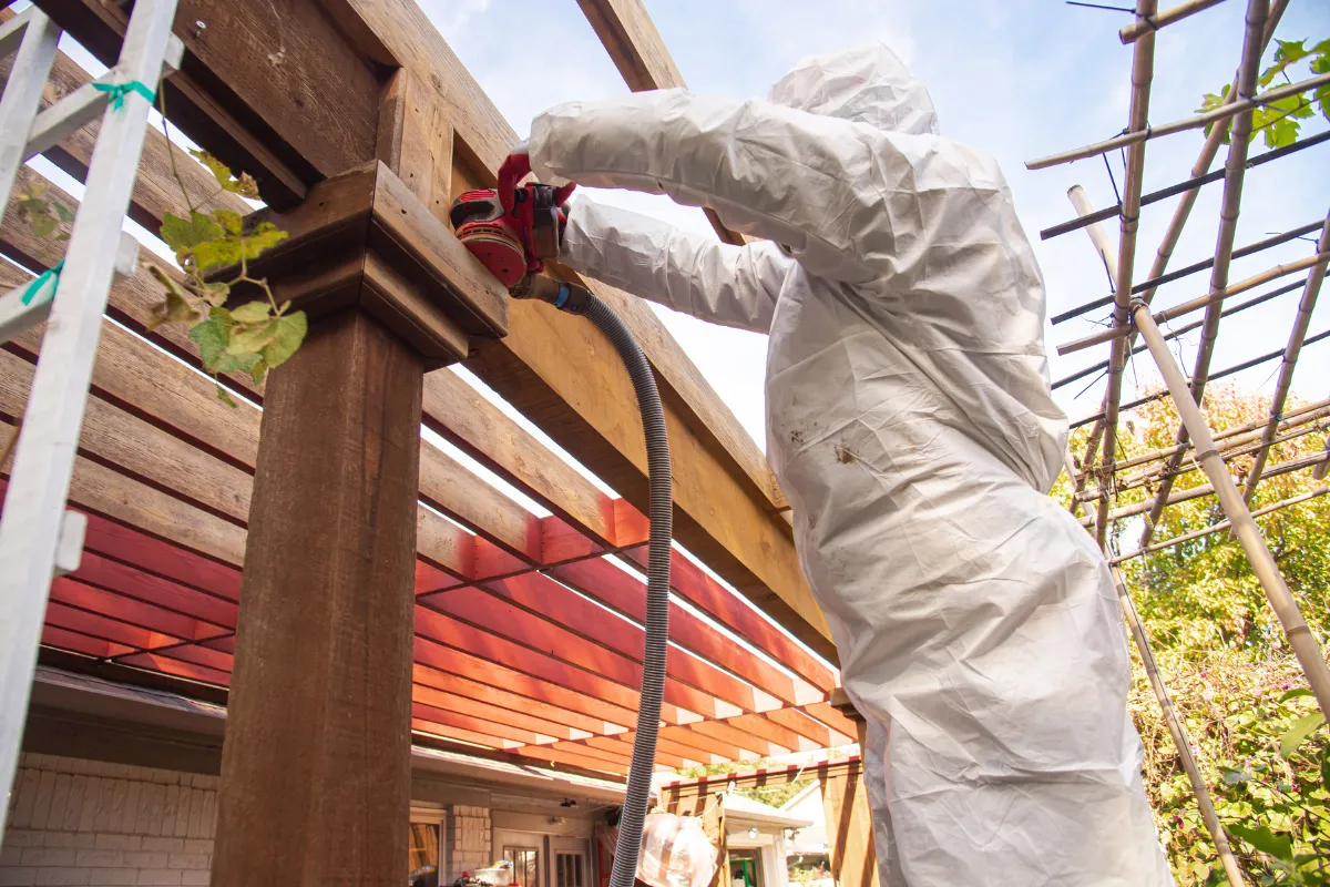 Backyard remodeling in Los Angeles with outdoor living structure construction, wood finishing, patio improvement, and backyard upgrade work in progress